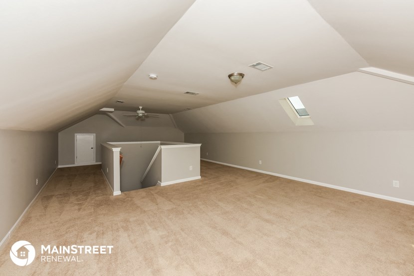 the attic of a home with a vaulted ceiling