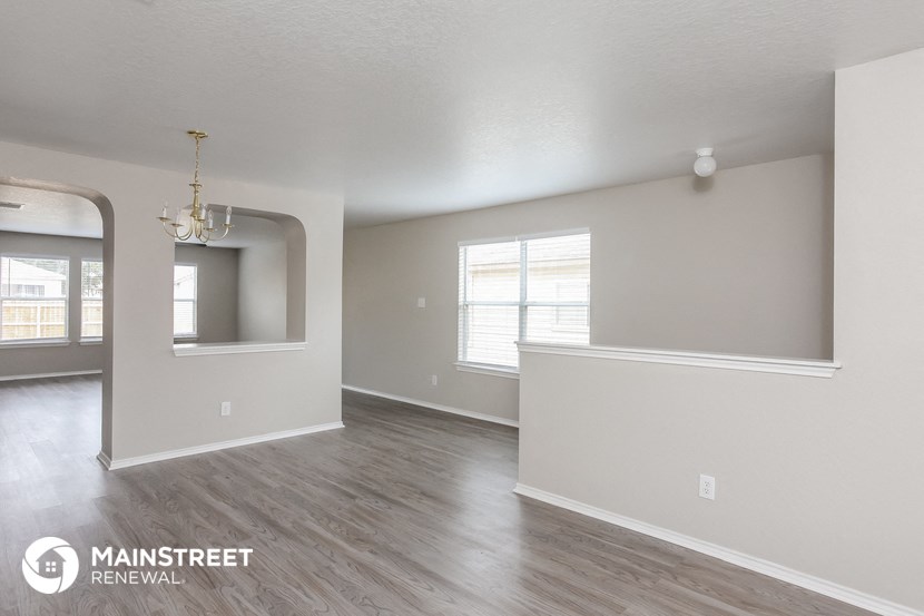 the living room and dining room in a 367 repurposed residence