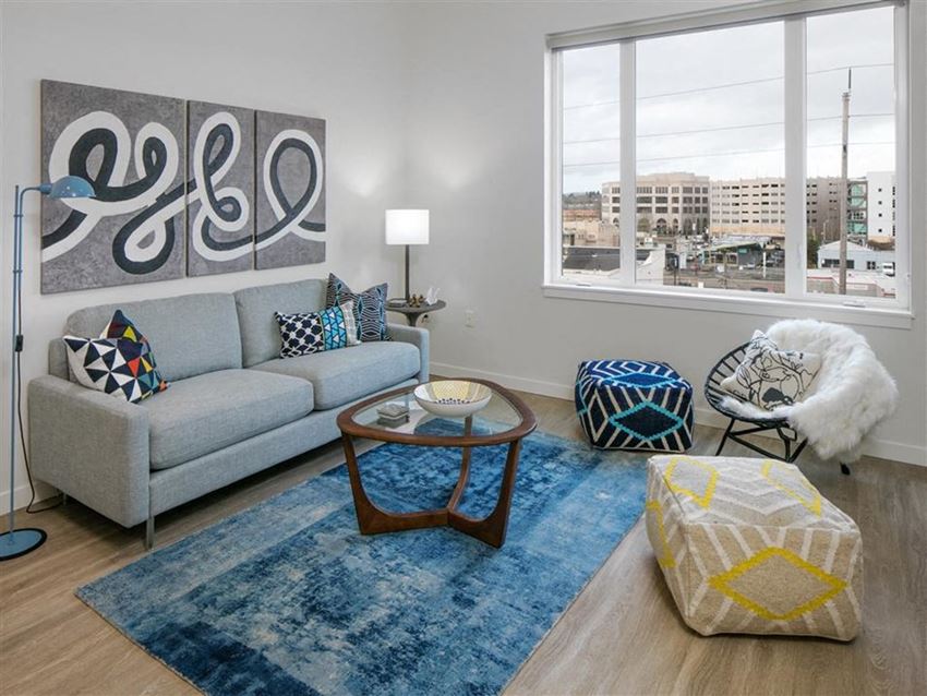 a living room with a couch and a window