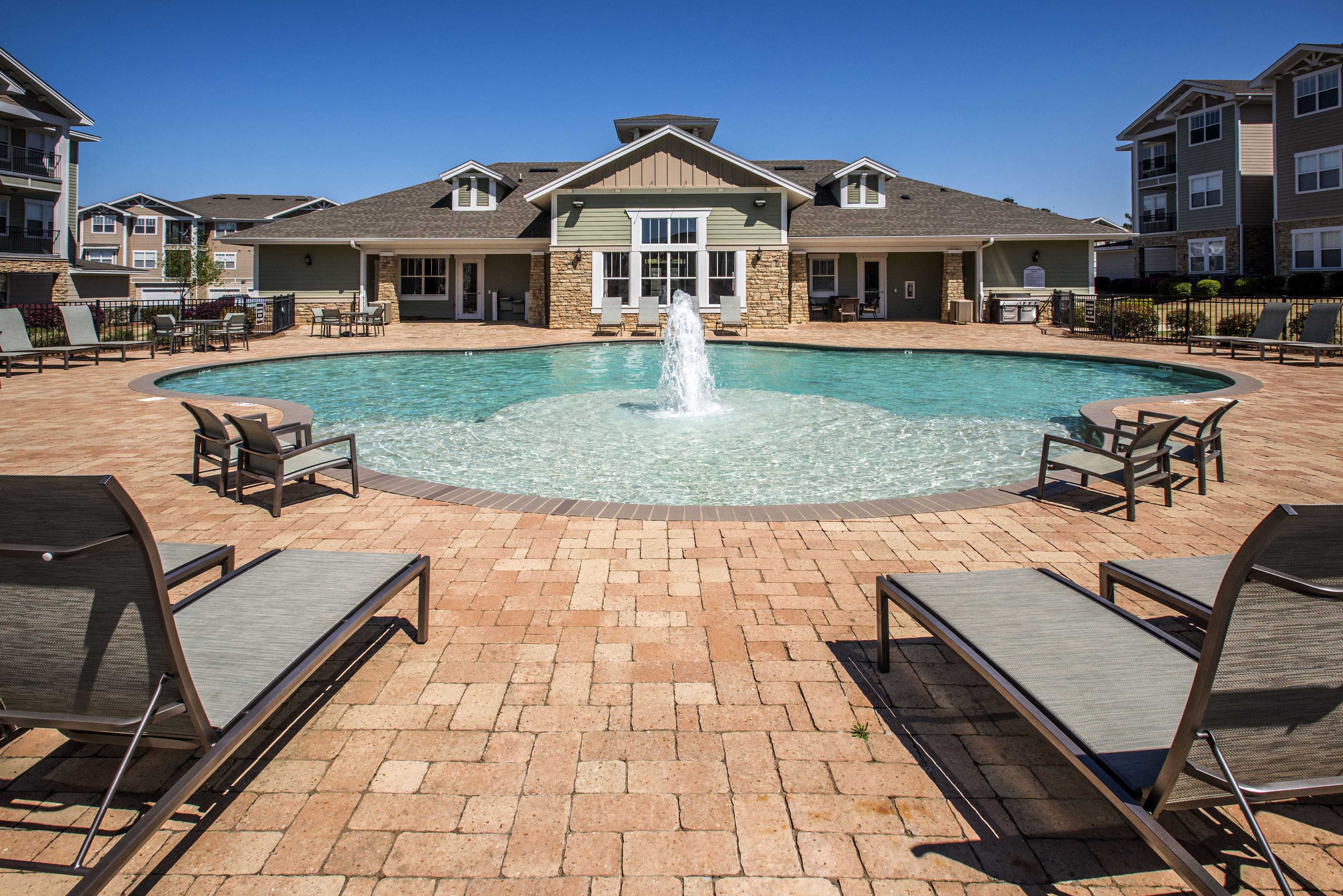 Madison AL Apartments for Rent - Arch Street - Sparkling Pool with Fountain in the Middle, Surrounded by Lounge Seating
