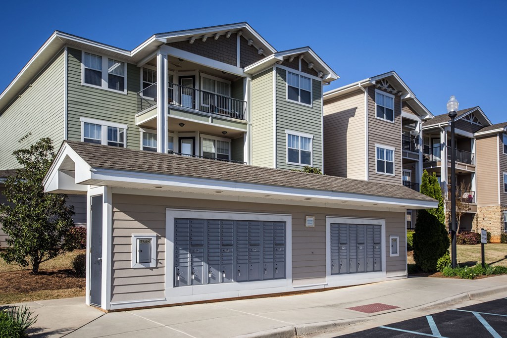 an apartment building with a garage door in front of it