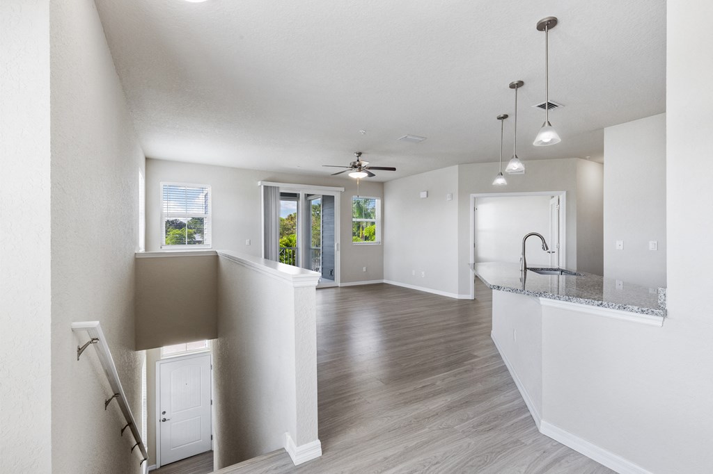 the living room and kitchen of a new home with an open floor plan