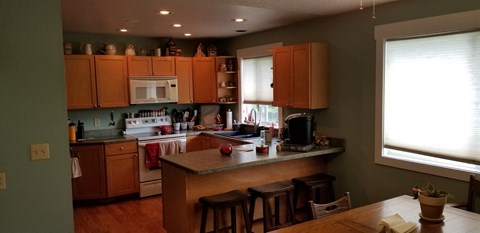 a kitchen with wooden cabinets and a counter top