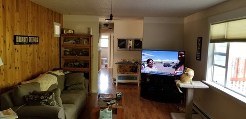 a living room with a couch and a tv