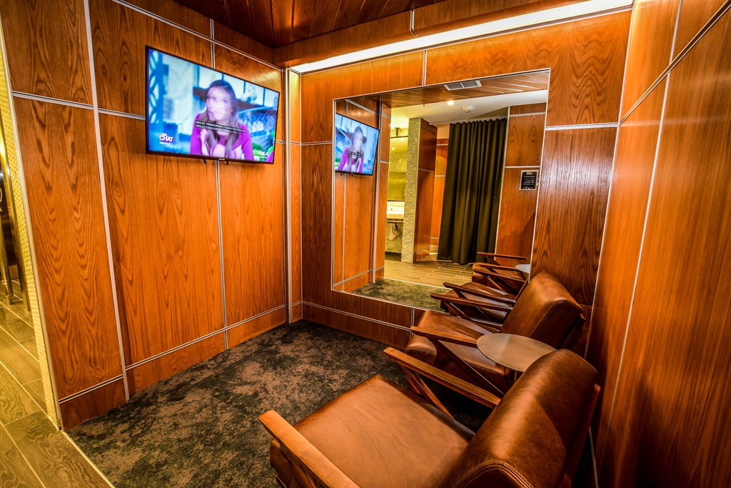 a conference room with chairs and a tv