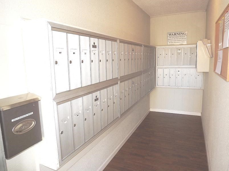 a locker room with many lockers and a mailbox
