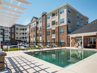 the swimming pool at the preserve at polo terrace apartments
