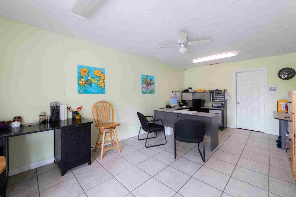 a dining room with a table and chairs and a kitchen