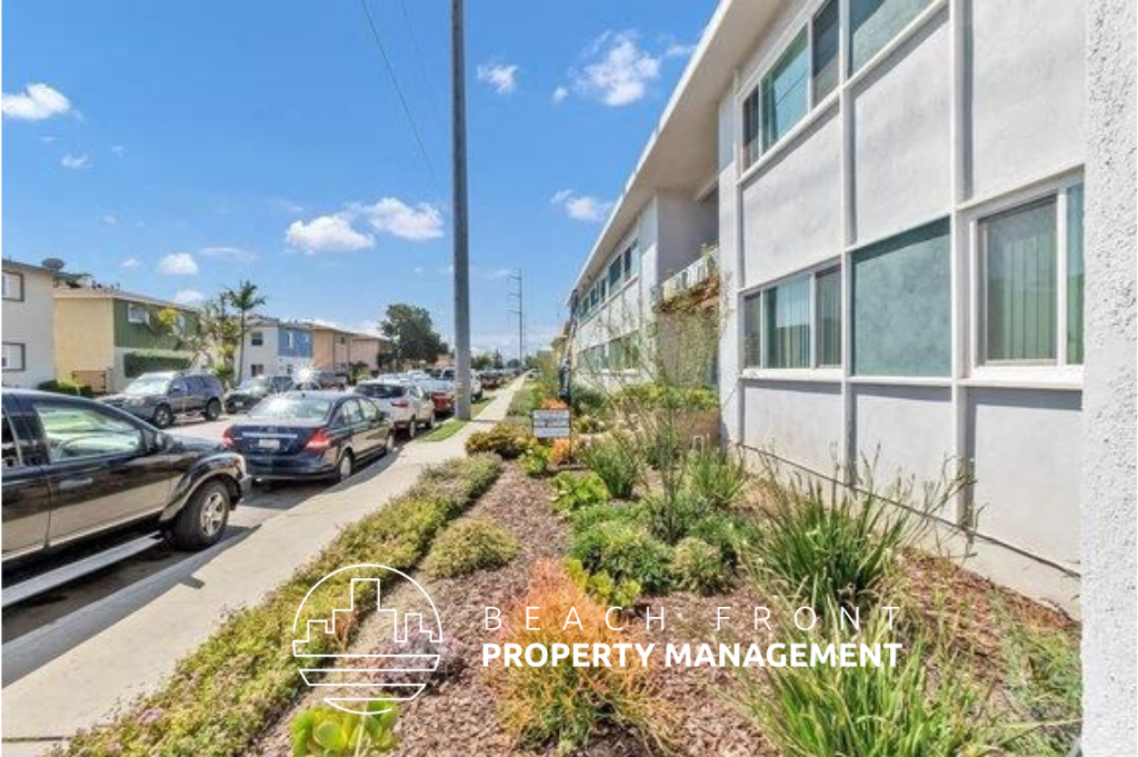 a city street with cars parked in front of a building