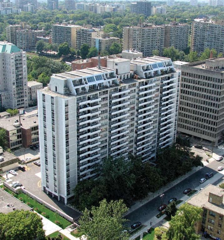 an aerial view of a city with tall buildings