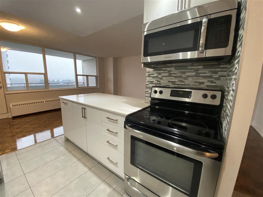 a kitchen with a stove and a microwave
