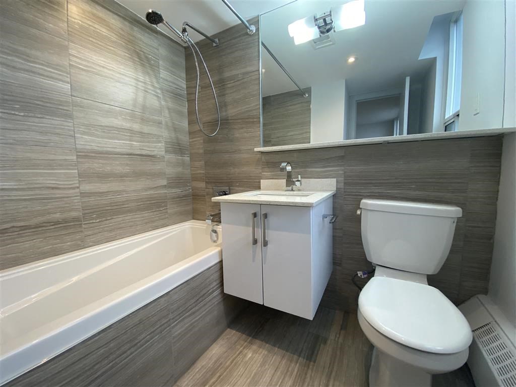 a bathroom with a toilet and a sink