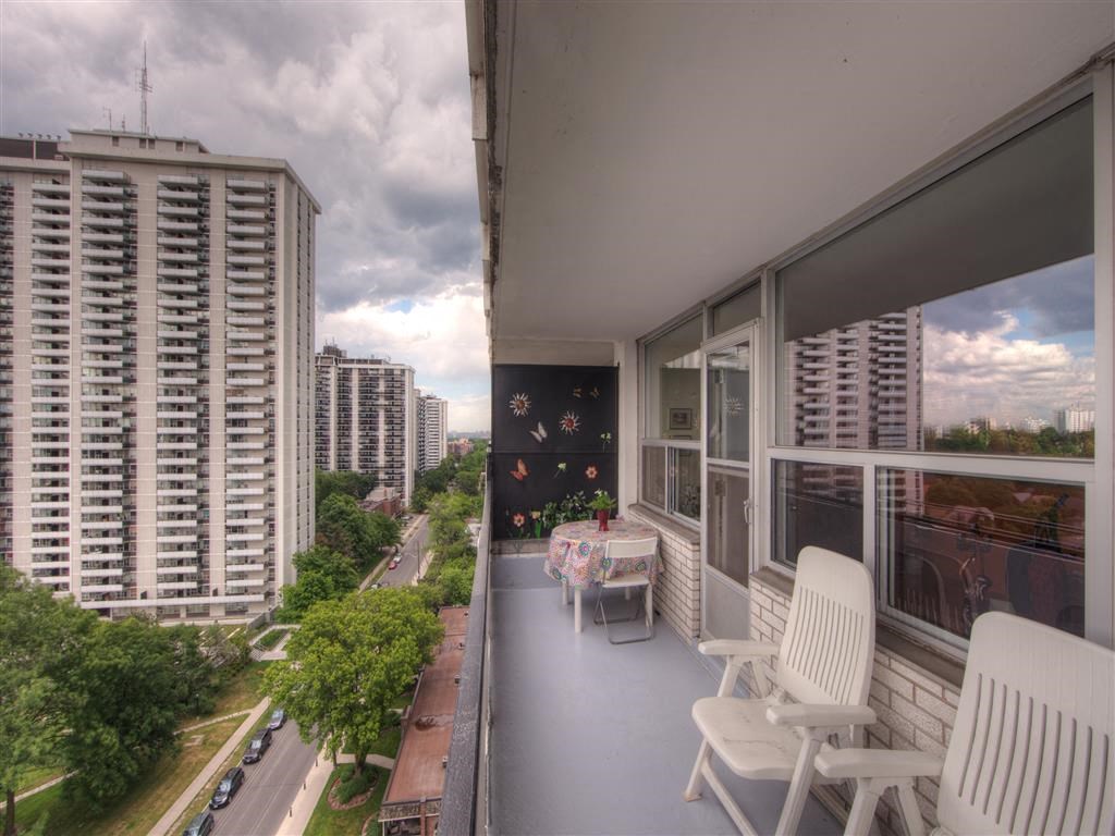 a balcony or terrace with a table and chairs on a balcony
