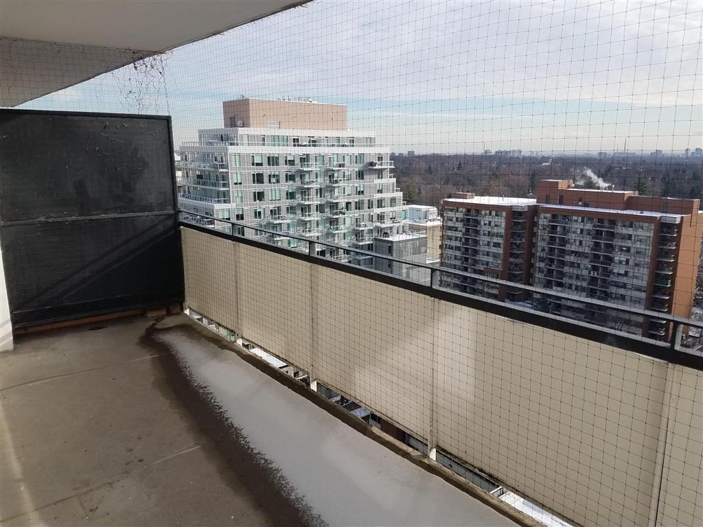 a balcony with a view of a city in the distance
