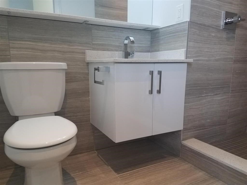 a bathroom with a toilet and a sink