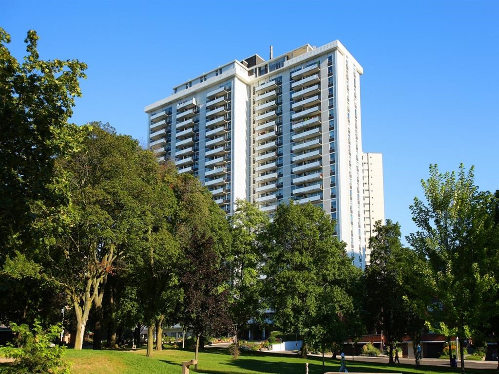 a tall building in the middle of a park
