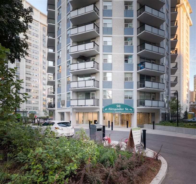 an apartment building on the corner of a street