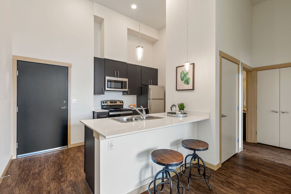Kitchen with cabinets and counter at Bridgeview 125, University Place, WA