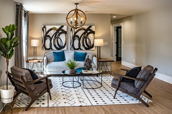 clubhouse-1 modern clubhouse with furnishings, wood-style floors, and chandelier - Photo Gallery 5