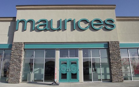 the front of a mannequins store with green doors