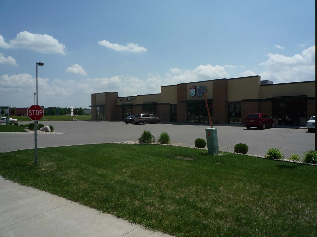 A stop sign is in front of a building.