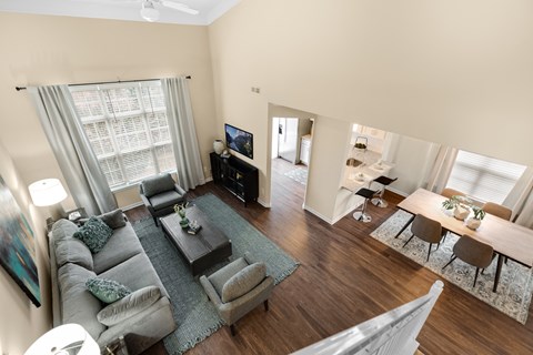 an aerial view of a living room with a couch and a table