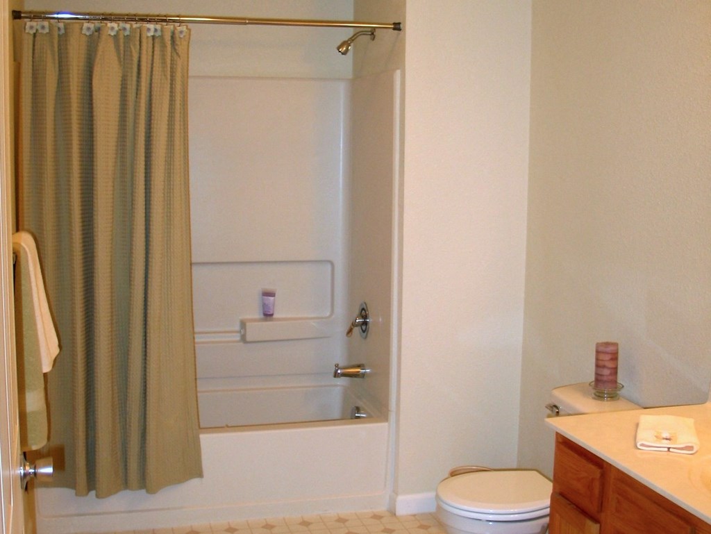 Large bathroom with shower and tub at Prairie Apartments