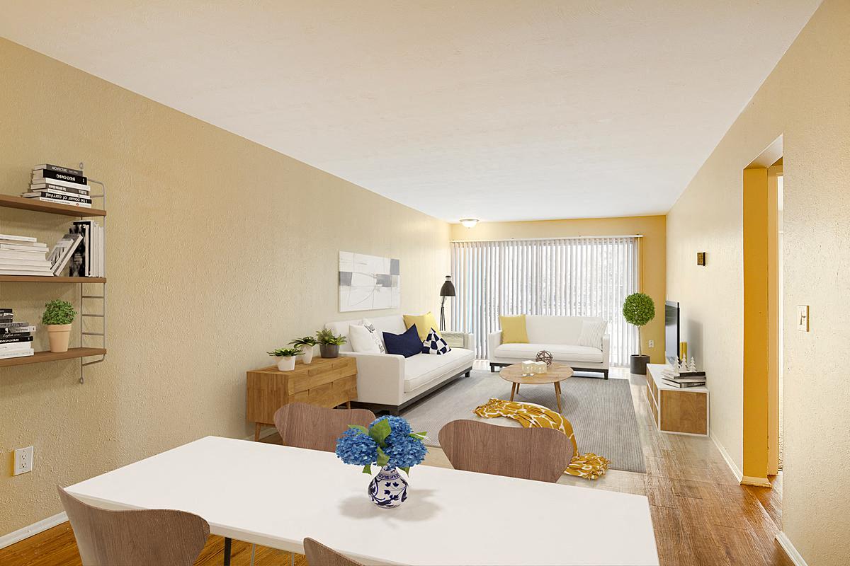 a living room and dining room with a white table