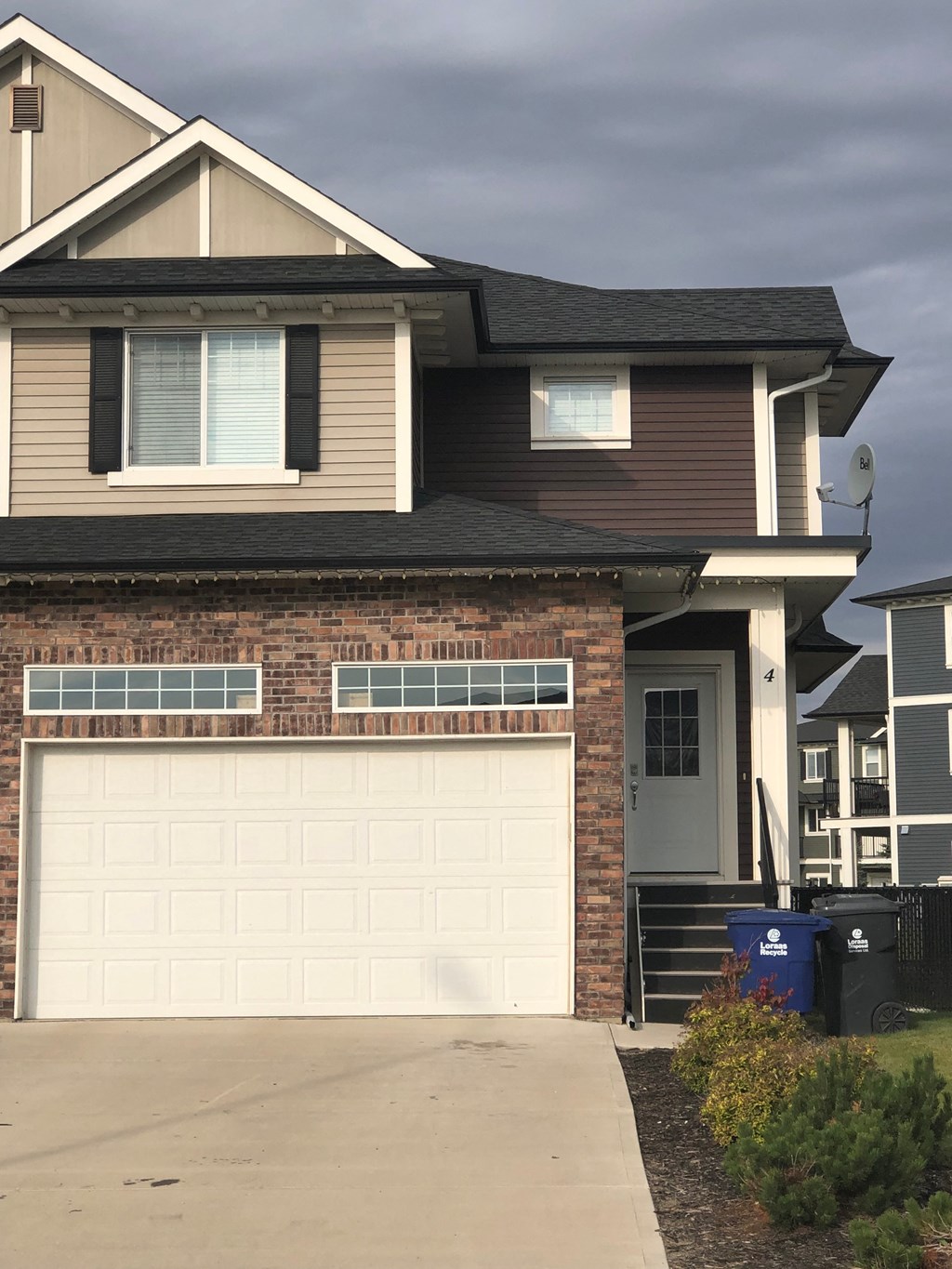 a house with a white garage door in front of it