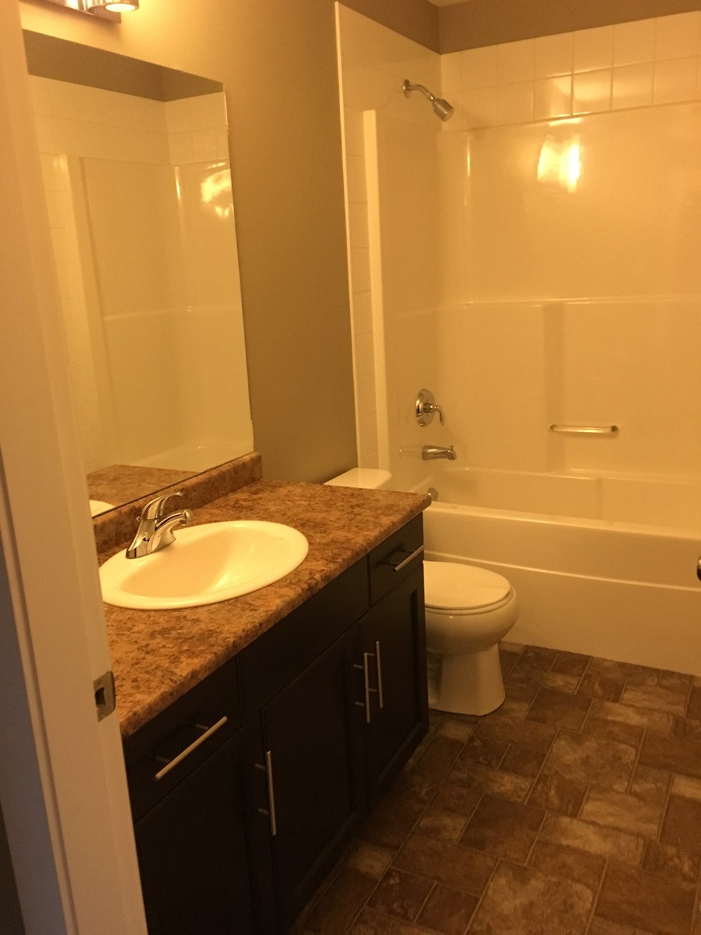 a bathroom with a sink toilet and bath tub