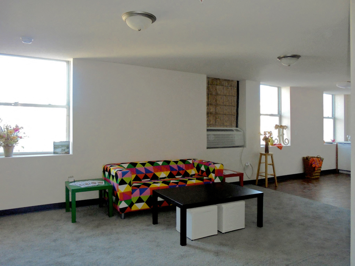 a living room with a couch and a table