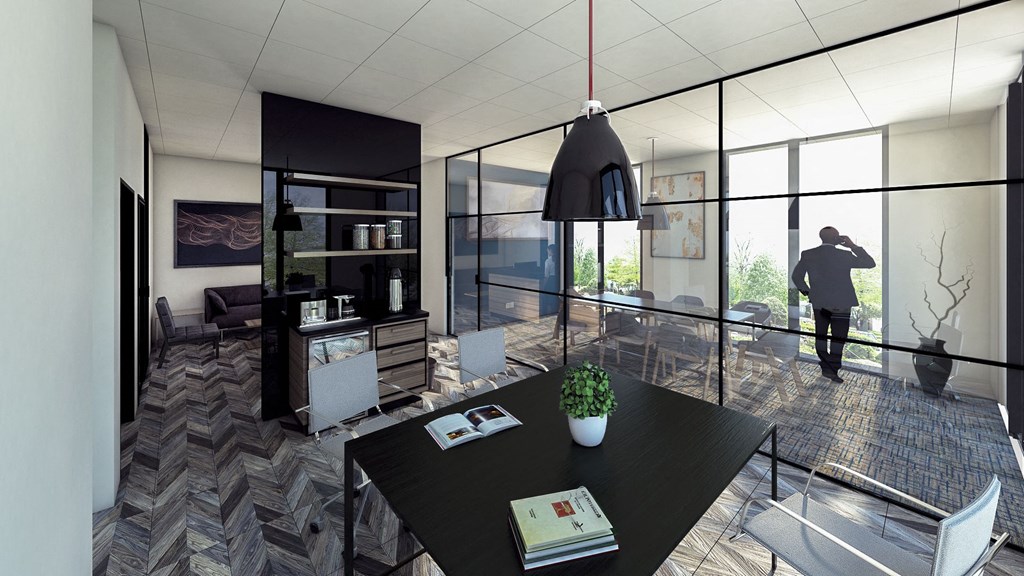 a man walking into a room with a table and chairs
