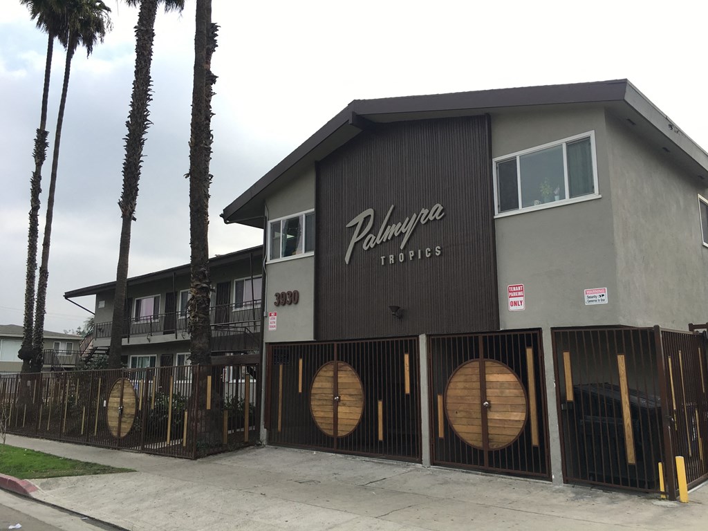 a building with wooden barrels on the side of it