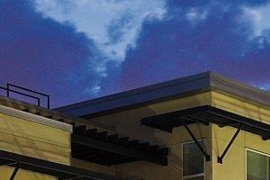 Exterior building and landscaped courtyard at night