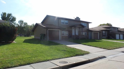 a house with a sidewalk in front of it
