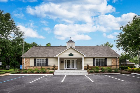 A building with a parking lot in front of it.