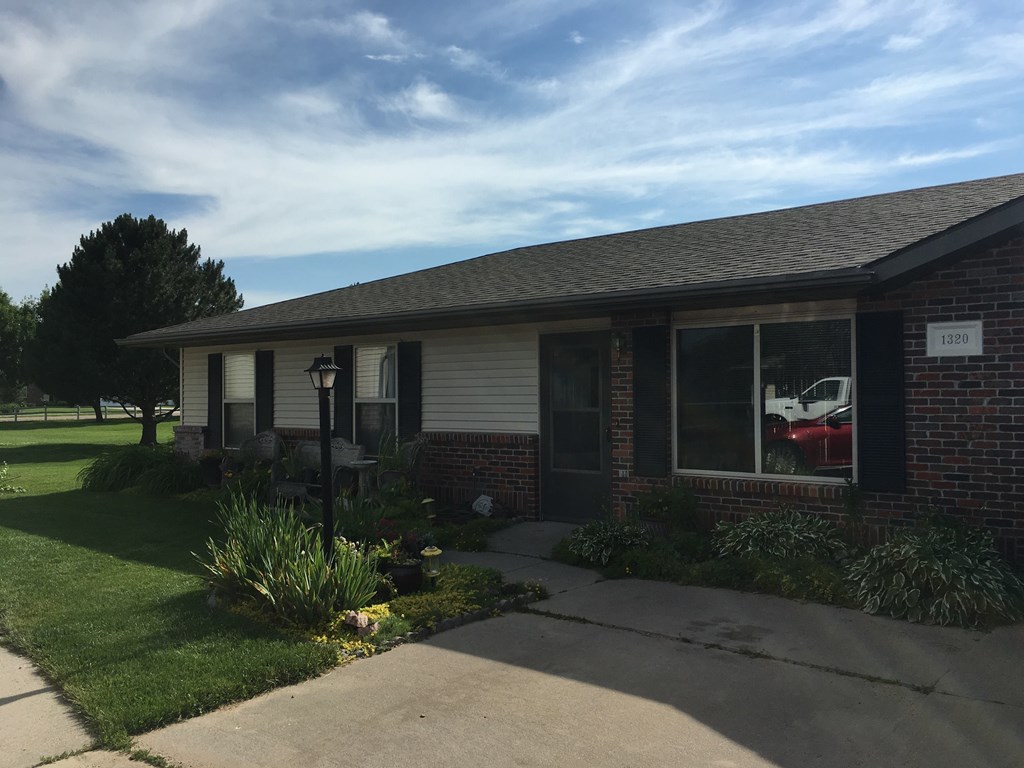 a house with a red car in the window