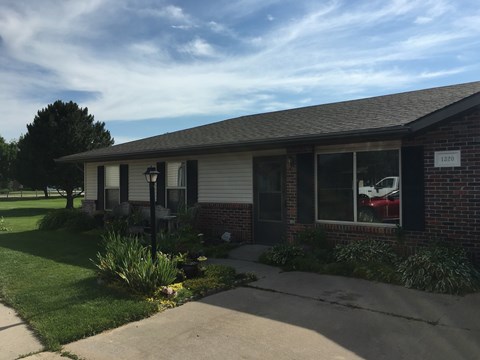 a house with a red car in the window