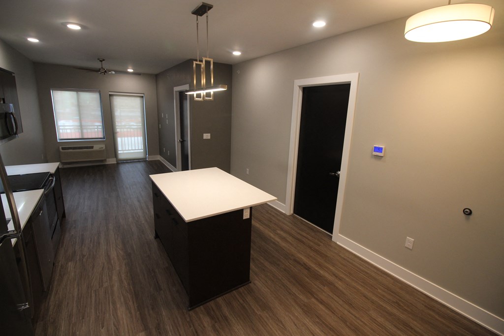 an empty kitchen and living room in a new home