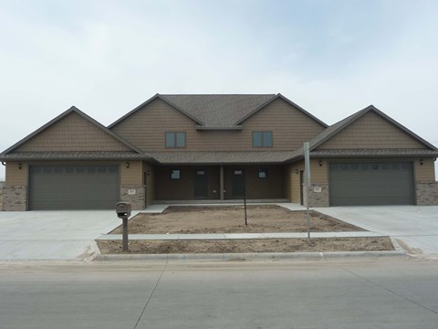 a house with a parking meter in front of it