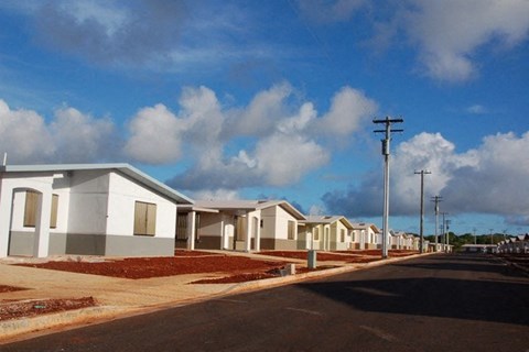 a row of houses on the side of a street