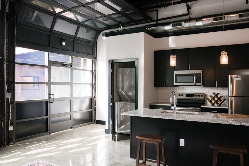 a kitchen with stainless steel appliances and a counter top