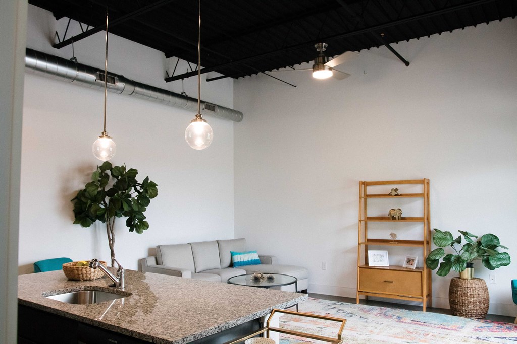 a kitchen with a granite counter top in a living room