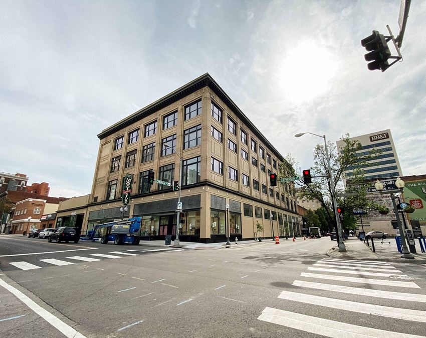 an old building on the corner of a city street