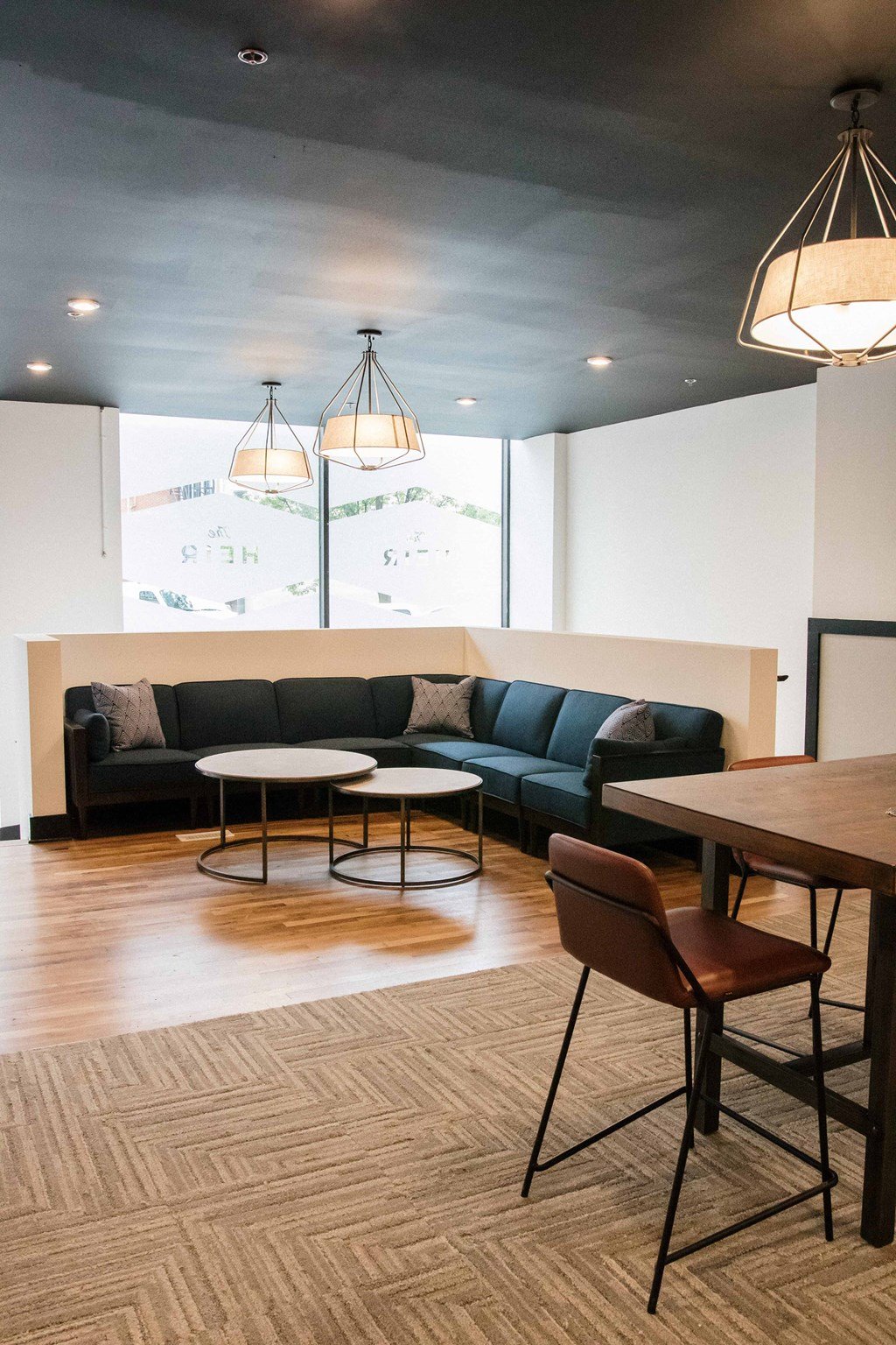 a living room with couches and tables