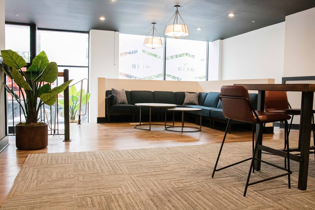 a living room with a couch and a dining table