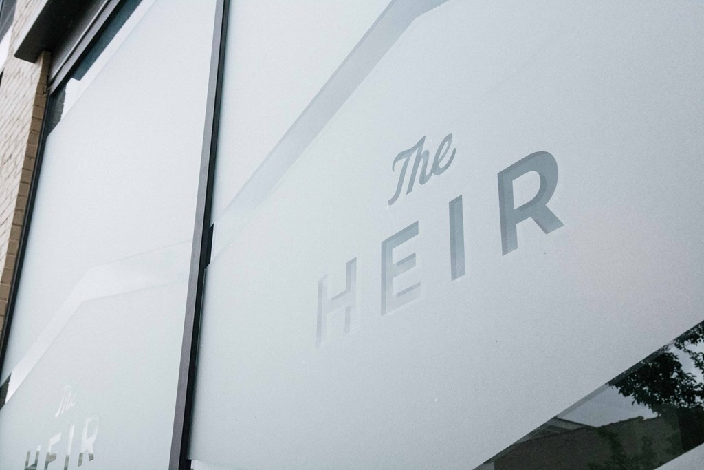 a white sign with the logo on it