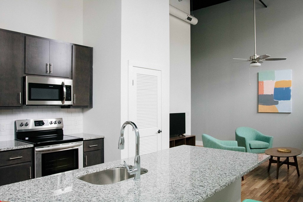 a kitchen with a counter top and a sink