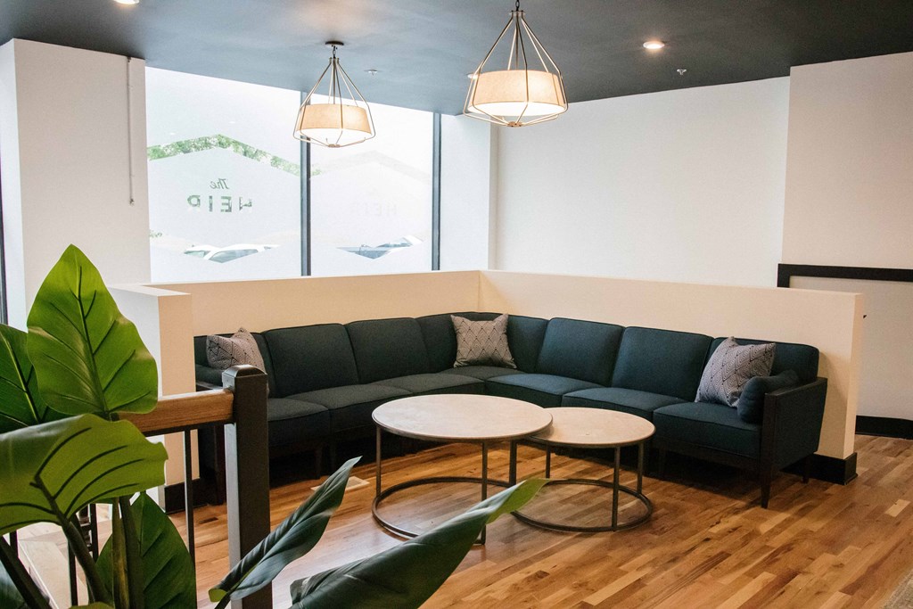 a living room with couches and tables