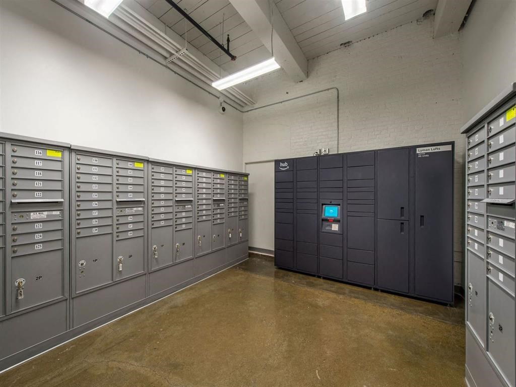 a row of gray lockers in a large room